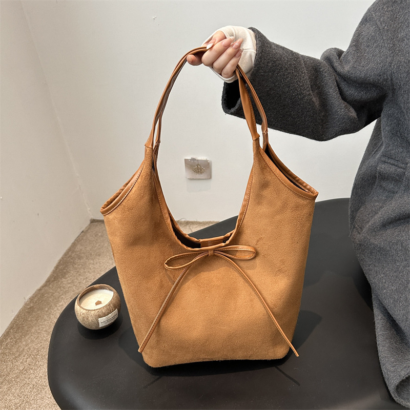 Bolsa de viaje al trabajo para mujeres estilo coreano retro de alta capacidad bolso de brazo 2025 primavera alta sensación bolso de hombro