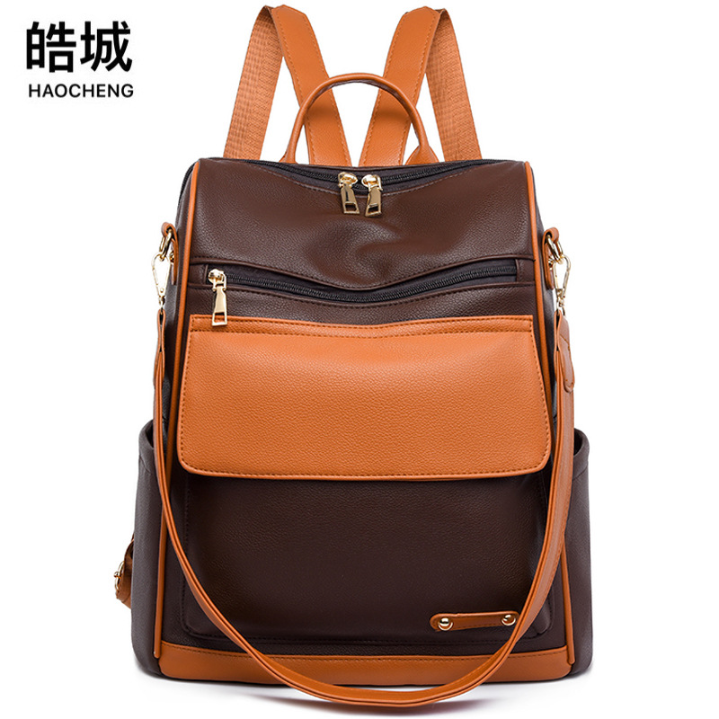 Mochila de color en contraste para mujer 2024 nueva mochila de viaje de gran capacidad de moda de cuero suave mochila multifuncional al por mayor