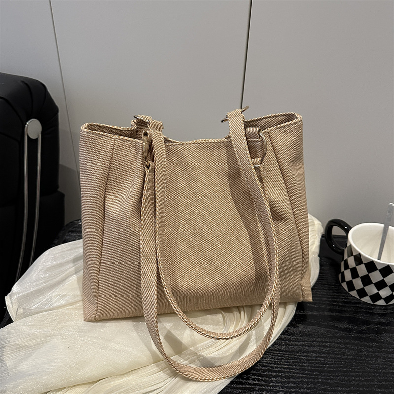 Bolsa de textura para mujeres de gran capacidad 2025 nueva primavera y verano ocio rayas bolsas de compras de hombro para clase de viaje bolsa