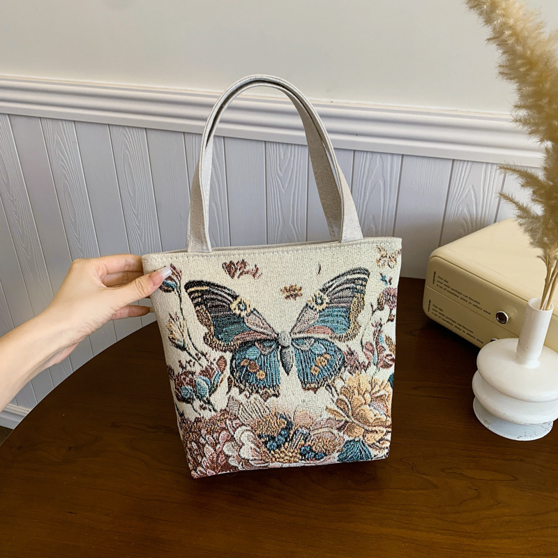 新しいファッショナブルで多用途なカジュアルな気質の女性のキャンバス両面ゴールデンシルクジャカード刺繍蝶ハンドバッグママバッグ|undefined