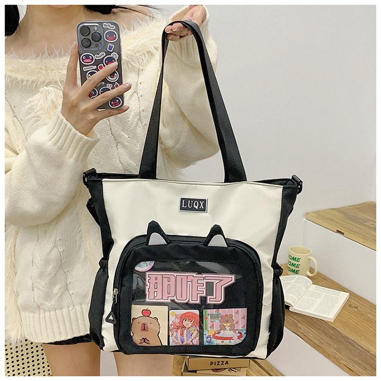 The new cute cartoon printed student bag with a large capacity and transparent student storage single-shoulder bag is selling well for women undefined