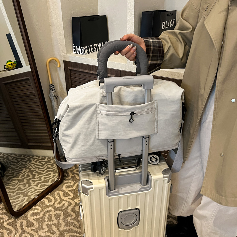 Nueva bolsa de viaje de tela de Oxford con ruedas, bolsa de viaje corto de gran capacidad, bolsa de almacenamiento para hombres, bolsa de embarque de viaje