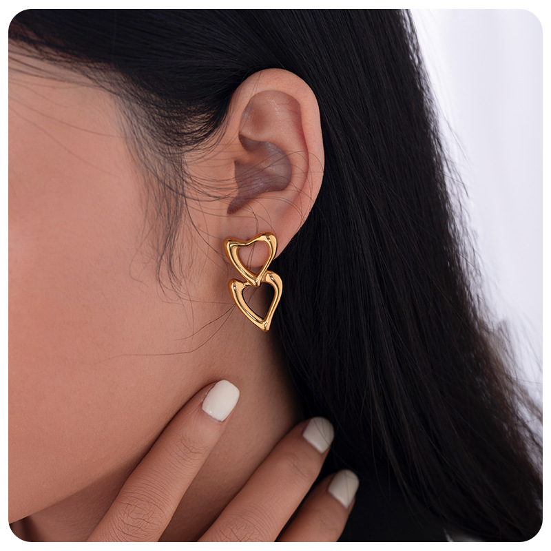 TENA nicho de amor amor amor hueco pendientes de acero inoxidable chapado en oro 18 quilates doble goteo de zircón pendientes de aceite