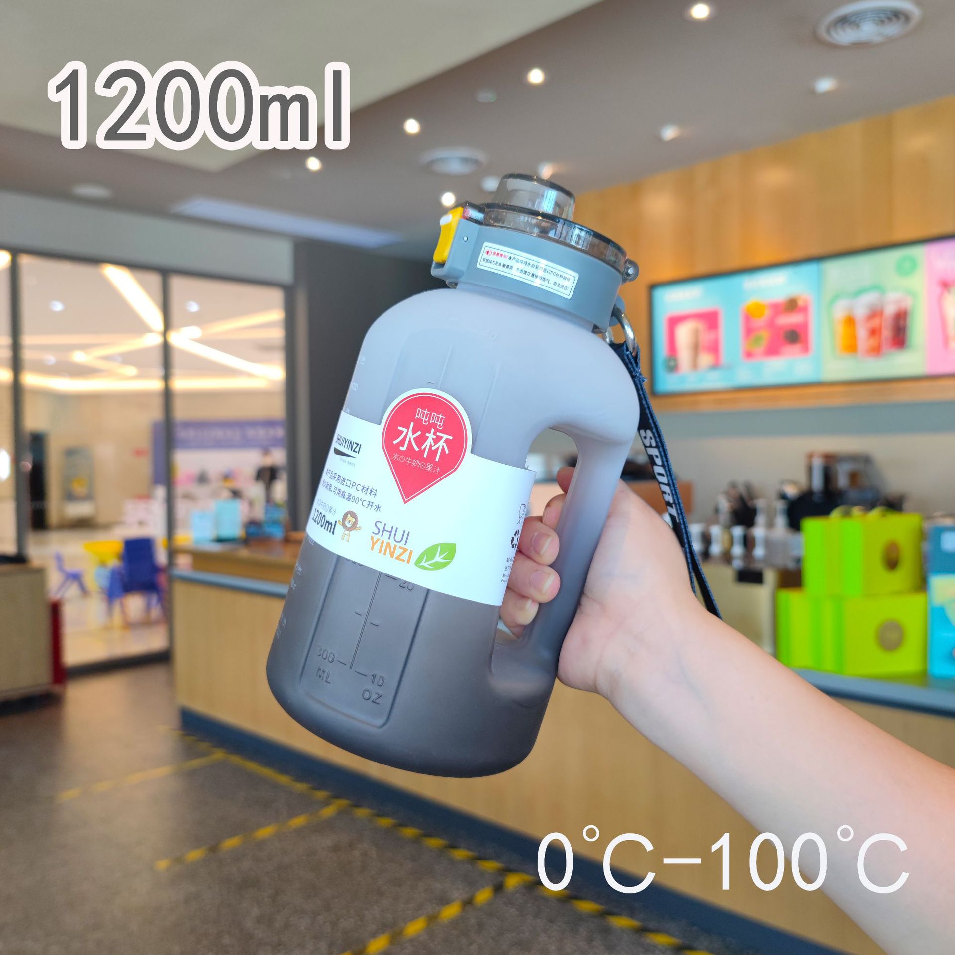 Botella de agua de plástico degradado de gran capacidad y alto valor con asa para fitness Botella de agua para deportes al aire libre 1200ml