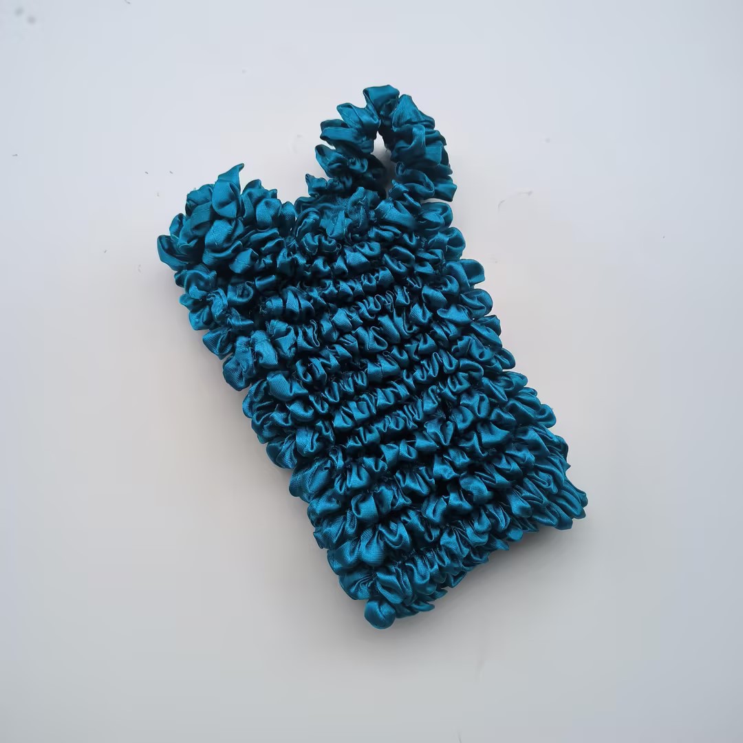 Bolso de burbuja multiusos popular de gran capacidad de la celebridad de Internet de las mujeres Bolso de burbuja japonés y coreano nuevo bolso mágico bolso telescópico bolso plisado