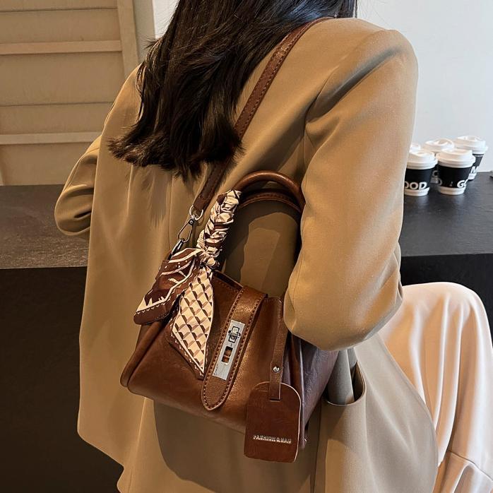 Bolso de mano universal de alta sensación para mujeres 2024 nuevo popular bolso de cubo de agua super caliente nicho de moda retro mochila