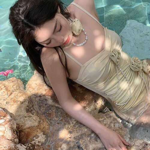 Luxury and stylish one-piece swimsuit for women with a light luxury, internet celebrity vibe, high-end sense, subtle shimmer, pearls, floral design, sexy and pure desire, small chest shaping, vacation style.