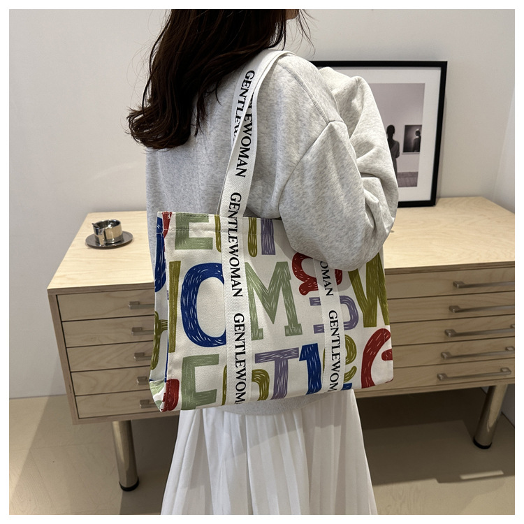 Large-capacity letter canvas bag 2025 new style ins printed versatile shoulder bag for commuting and portable ladies' tote bag undefined