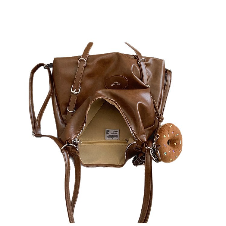 Mochila de viaje casual de mujer de gran capacidad mochila de cuero suave 2025 nueva mochila de estilo relajado retro versátil