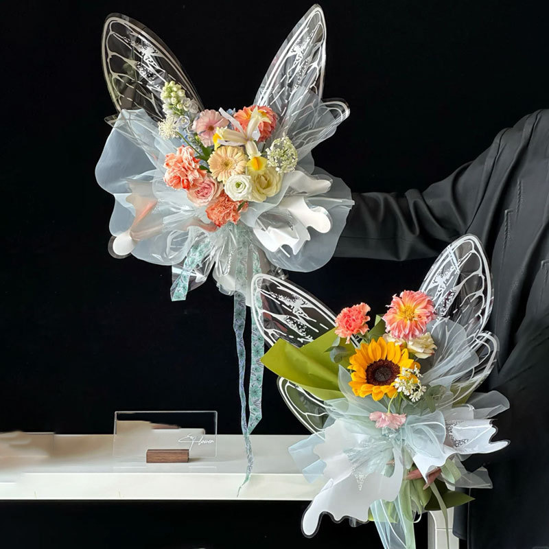 Fábrica de fiestas de flores de venta caliente creativo transfronterizo nuevo papel de embalaje de flores de mariposa transparente ramo de flores papel de embalaje