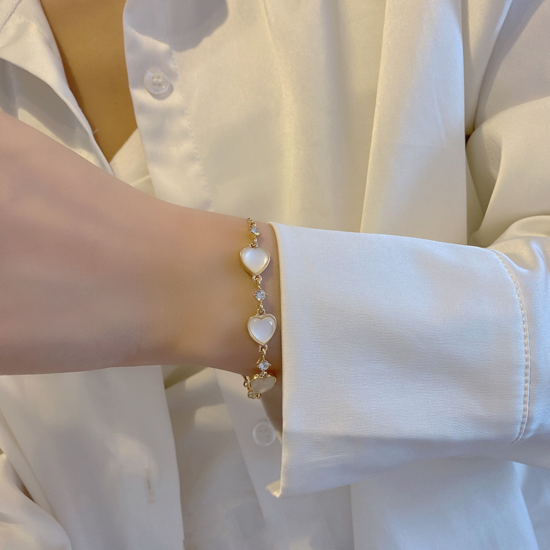 Koreanische Nachahmung Katzenauge Verstellbares Herz Armband Mode Metall Textur Hand Ornament Großhandel display picture 7