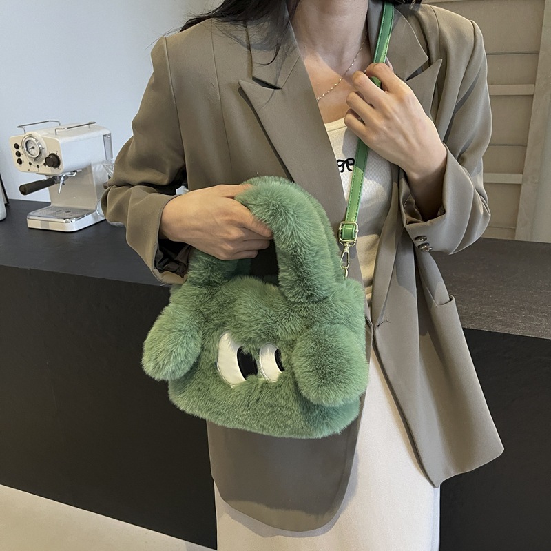 Bolsa de cubo de pelúcia de ojos grandes perros mujeres otoño y invierno 2025 nuevo tipo de bolso de hombro, bolso de mochila encantador