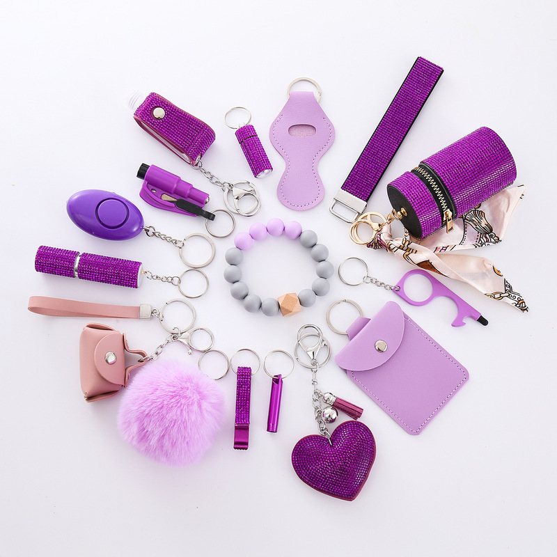 Amazon outdoor self-defense flashlight alarm 16-piece set keychain accessories bottle convenient fur ball pendant