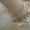 Green small bell with tassels, bracelet
