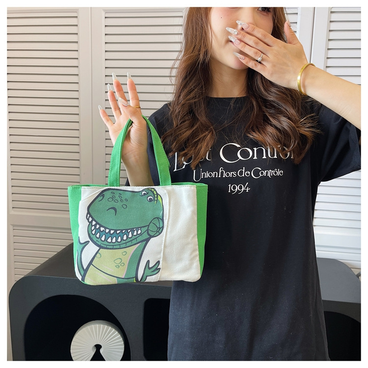 Cute cartoon printed small bag, 2024 summer new style hand-held piggy girl handbag, student storage canvas bag undefined