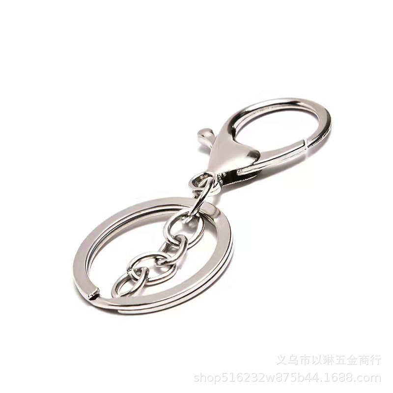 金属メッキのロブスターの鍵は腰の間の掛け物を掛けます。|undefined
