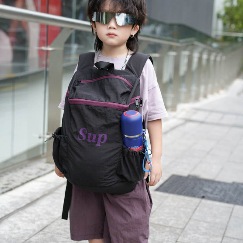 Mochila coreana para niños y niñas, mochila deportiva de viajes de gran capacidad, mochila para niños con letras de aire extranjero 2025, mochila para niños