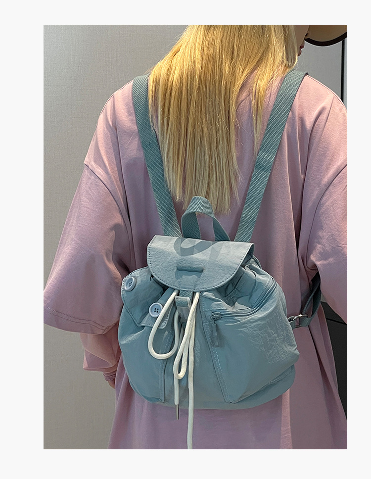Colorful Fox's new Korean-style ins women's niche design lightweight pocket button drawstring backpack undefined