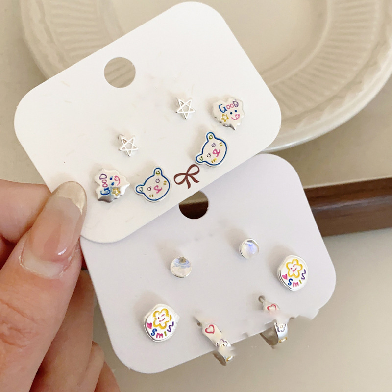 Pendientes redondos de color de aguja de plata Pendientes frescos y dulces Pendientes de todo fósforo de moda simple para mujer