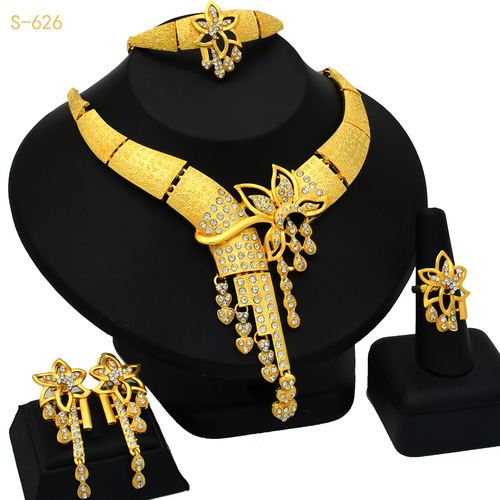 Gold-plated jewelry set for Nigerian bride, featuring an exaggerated flower-themed long necklace, ring, bracelet, and earrings set of four