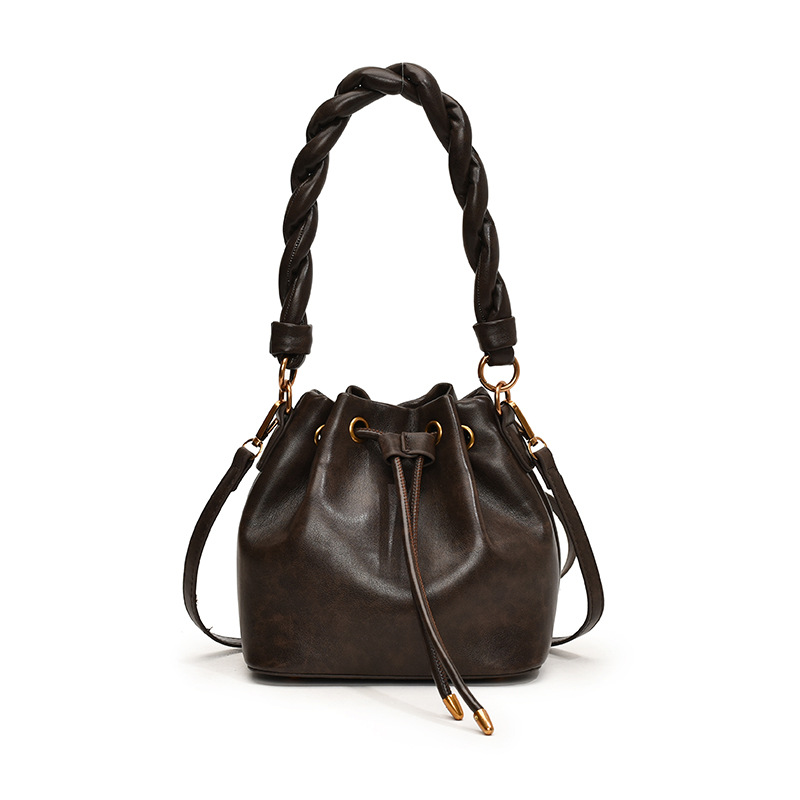 Bolsa de cubo de moda retro 2024 nueva moda de nicho de alta sensación bolso de hombro de diseño versátil bolso de mochila