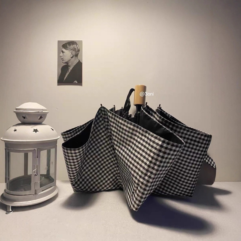 Wholesale Korean Black and White Plaid Vinyl Sunshade Three Portable Umbrellas Dual-Purpose Umbrellas High-Value Folding Sun Protection Umbrellas Wholesale Korean Black and White Plaid Vinyl Sunshade Three Portable Umbrellas Dual-Purpose Umbrellas High-Value Folding Sun Protection Umbrellas