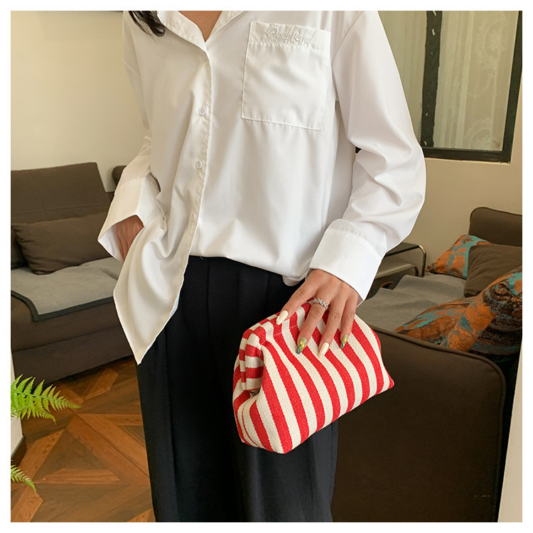 New cross-border fashion color-blocking striped cosmetic bag, women's loose change mobile phone storage bag, trendy and niche cloud clutch undefined
