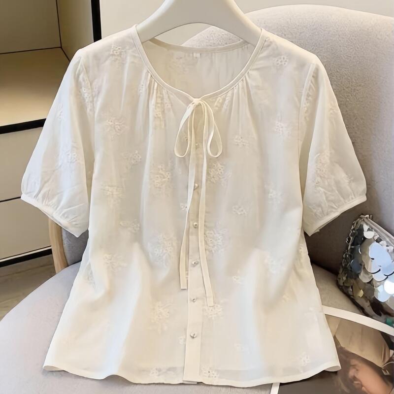 Plus-size solid color embroidered lace-up short-sleeve shirt for women, 2026 summer new style, loose-fitting, slimming, tummy-concealing, commuter top Plus-size solid color embroidered lace-up short-sleeve shirt for women, 2026 summer new style, loose-fitting, slimming, tummy-concealing, commuter top