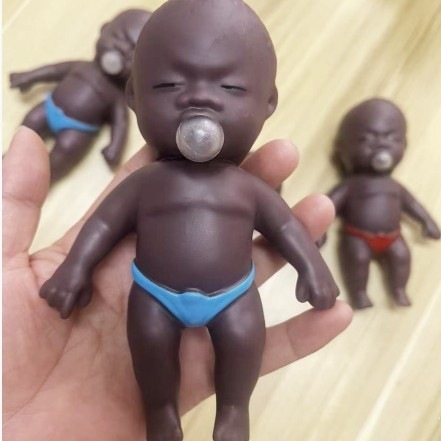 Popular online stress reliever: Natasha bubble-blowing black doll squeezeable toy figure for stress relief.