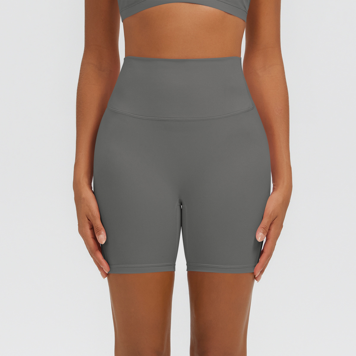 Nuevo tipo delgado de hielo, piel transpirable, ajustado, color sólido, ropa de yoga, pantalones cortos de tres puntos.