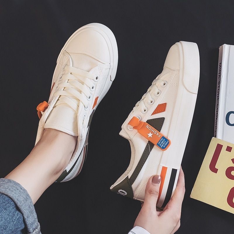 Zapatos blancos de primavera y otoño para mujeres zapatos de lona de altura baja primavera 2026 nuevos estudiantes coreanos zapatos de goma transfronterizos transfronterizos