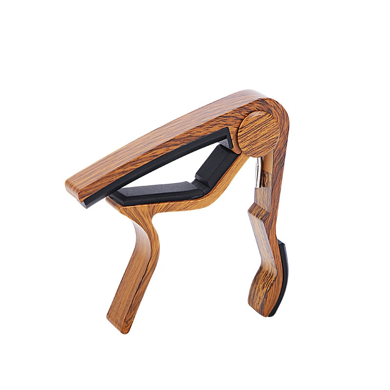 Guitar capo, wood‑grain finish, for acoustic/electric guitar and ukulele, with picks/tuner options