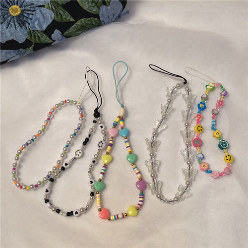 New Korean version ins creative bohemian soft clay smiling face pearl beaded butterfly mobile phone lanyard mobile phone chain for women