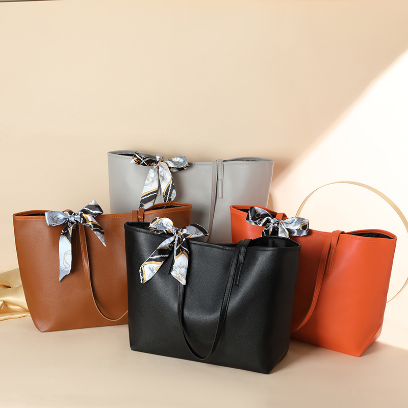 Bolsa de moda de comercio exterior simple y de gran capacidad 2024, nueva pañuelo de seda litchi decorado bolso de hombro de mujer de color sólido