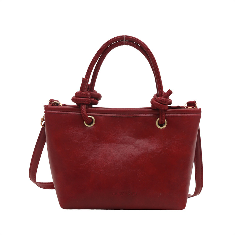 Bolso de moda simple 2024 invierno nuevo estilo retro textura bolso de cubo de moda color sólido viaje mochila de hombro