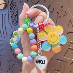 漫画の太陽の花の数珠のブレスレットのアイデアの虹の自動車のキーはカップルを掛けて自動車のペンダントを包んで卸売りの小さい贈り物を包みます。