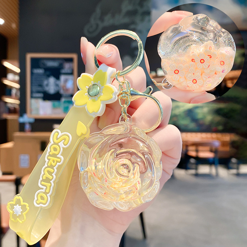 Llavero de rosa de aceite creativo lindo líquido arenas movedizas colgantes pequeños bolsos accesorios pareja pequeños regalos al por mayor