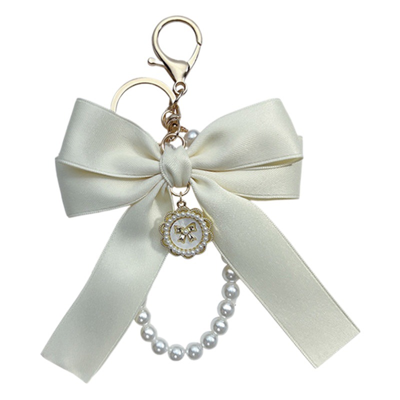 Creativo arco perla cadena llavero bolso de la manera de las mujeres colgante coche clave cadena personalizada cinta pajarita