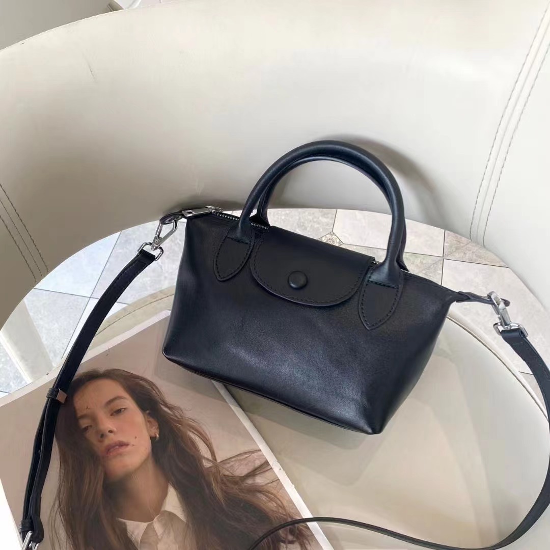 Bolsos femeninos 2024 nuevos bolsos femeninos de cuero de alta costura de moda 100 bolsos correccionales para viajeros de nicho bolsos portátiles