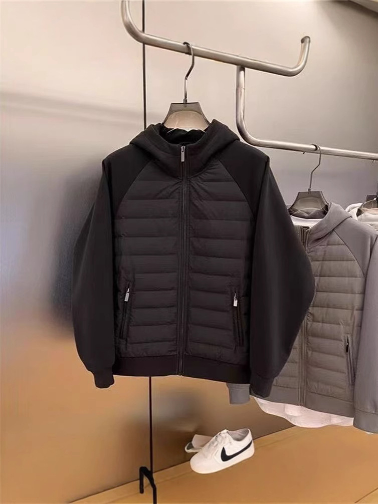 ファッション秋冬2025年帽子付きデザイン感カジュアルな純色の大衆が男性青年の帽子付きコートをつなぎ合わせて保温する