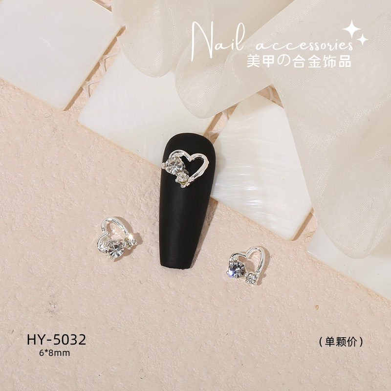 Nuevo arco de uñas amor aleación decoración de uñas flor de la luna mariposa clavo taladro fábrica joyería al por mayor