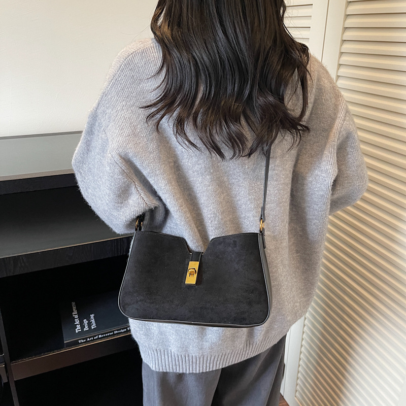 Transfronterizos de alto nivel esmerizado bolsas de brazo portátiles mujeres 2025 invierno nuevo tipo de lujo nicho bolso de hombro de viaje mochila