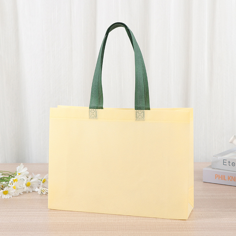 Bolsas de tela no tejida tiendas de souvenirs de viajes de madres y bebés en línea bolsa de compras de mano engrosada bolsa de mano image 19