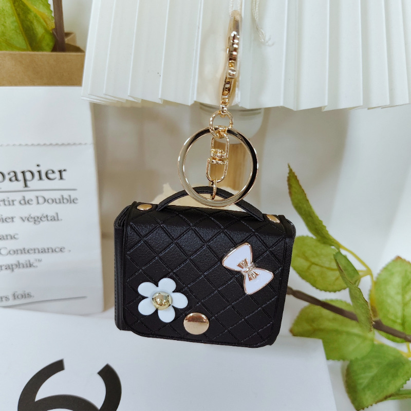 Nuevo estilo transfronterizo, moderno y exclusivo mini bolso acolchado tipo colgante, monedero para llaves, accesorio para auriculares.