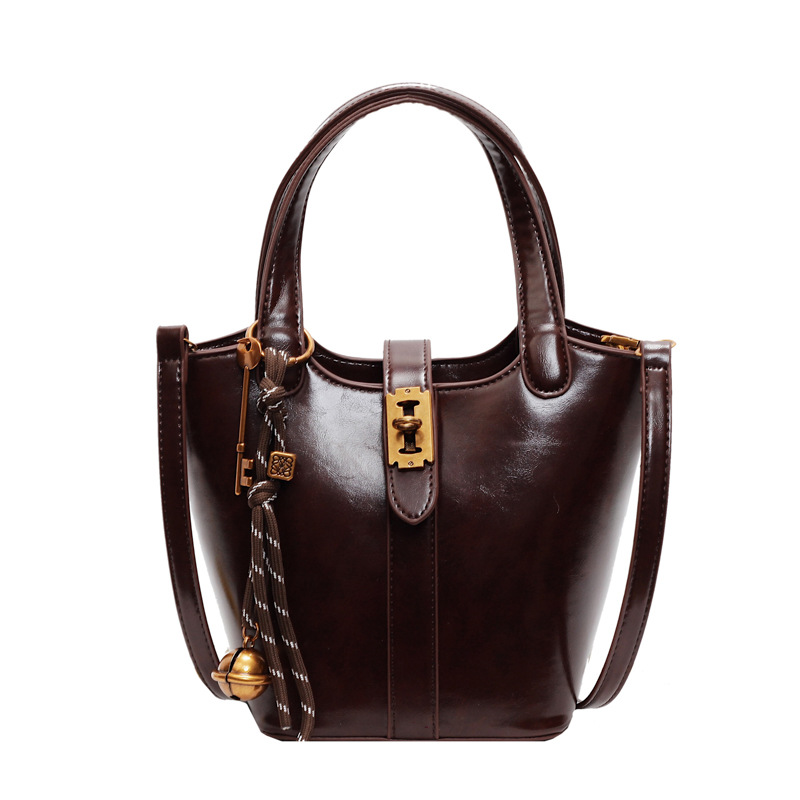 Moda retro bolso de cubo de mano para mujeres 2024 nuevo estilo coreano bolso de hombro casual de alta calidad humedad versátil bolso de mochila