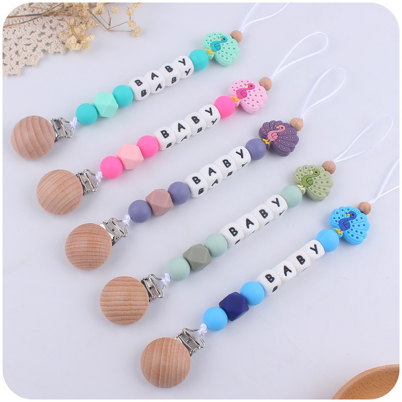 Nuevo bebé de dibujos animados animal mariposa Pavo Real búho mordedor calmante bebé molar pezón anti-gota cadena