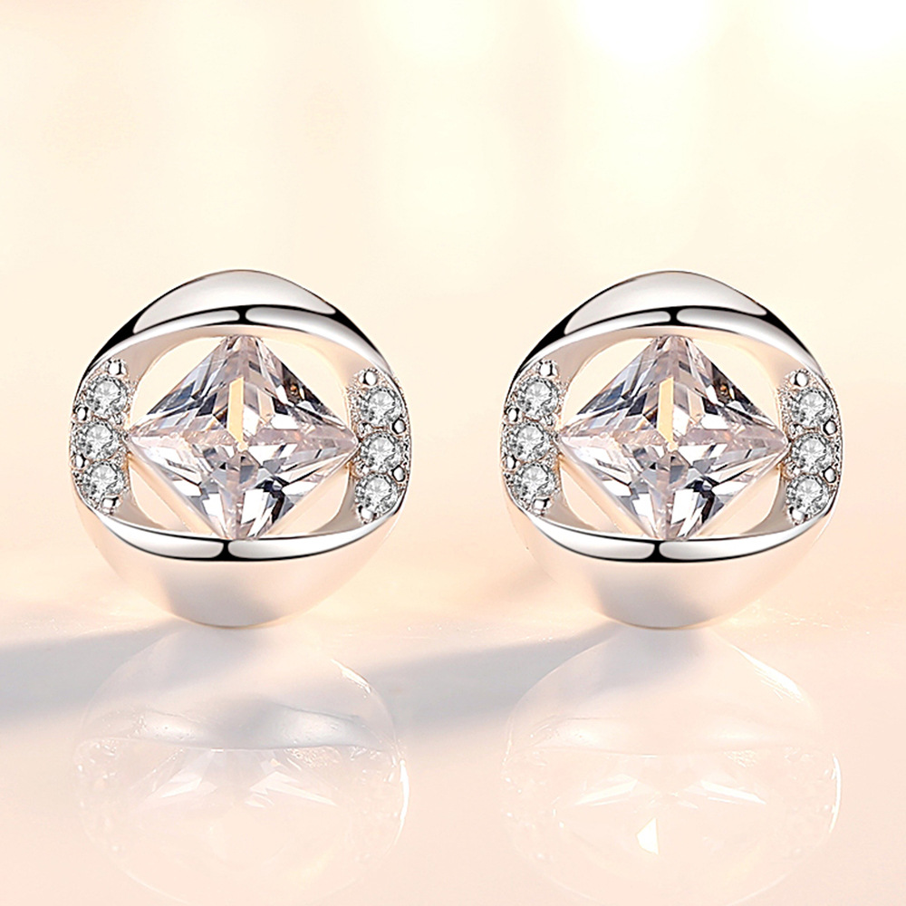 Fashionable fuchsia earrings with zircon