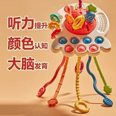 国境を越えたタコのラーラーが押すと、おもちゃの赤ちゃんをかじることができます。