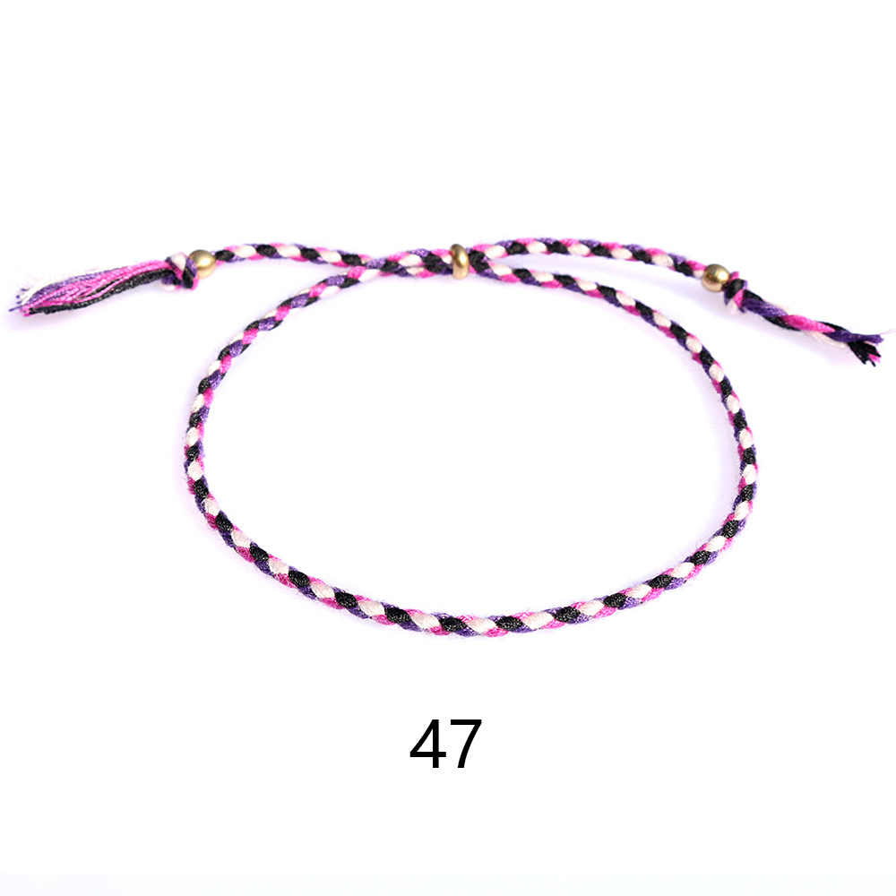 Amazon popular colorido cuerda de algodón amistad pulsera perlas de cobre borla pulsera tejida a mano ajustable hombres y mujeres pulsera
