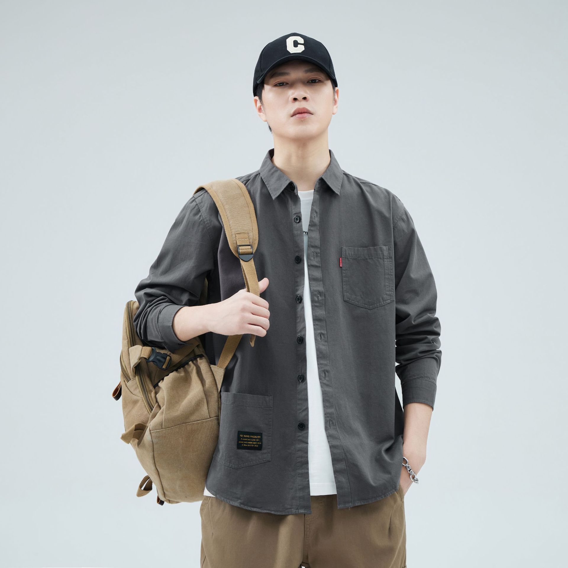 Camisas personalizadas de fábrica para hombres primavera y verano algodón de manga larga tendencia de ropa de estilo americano con solapa de bolsas de moda de ropa de estilo